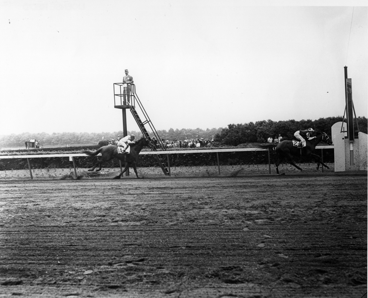 Assault (Warren Mehrtens up) winning the 1946 Belmont Stakes (Keeneland Library Morgan Collection/Museum Collection)