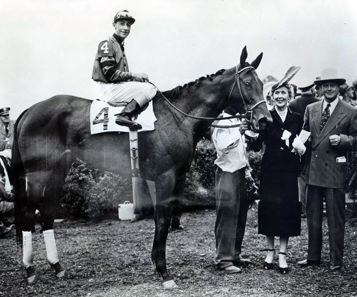 Real Delight (Eddie Arcaro up) in the winner's circle for the 1952 Coaching Club American Oaks (Museum Collection)