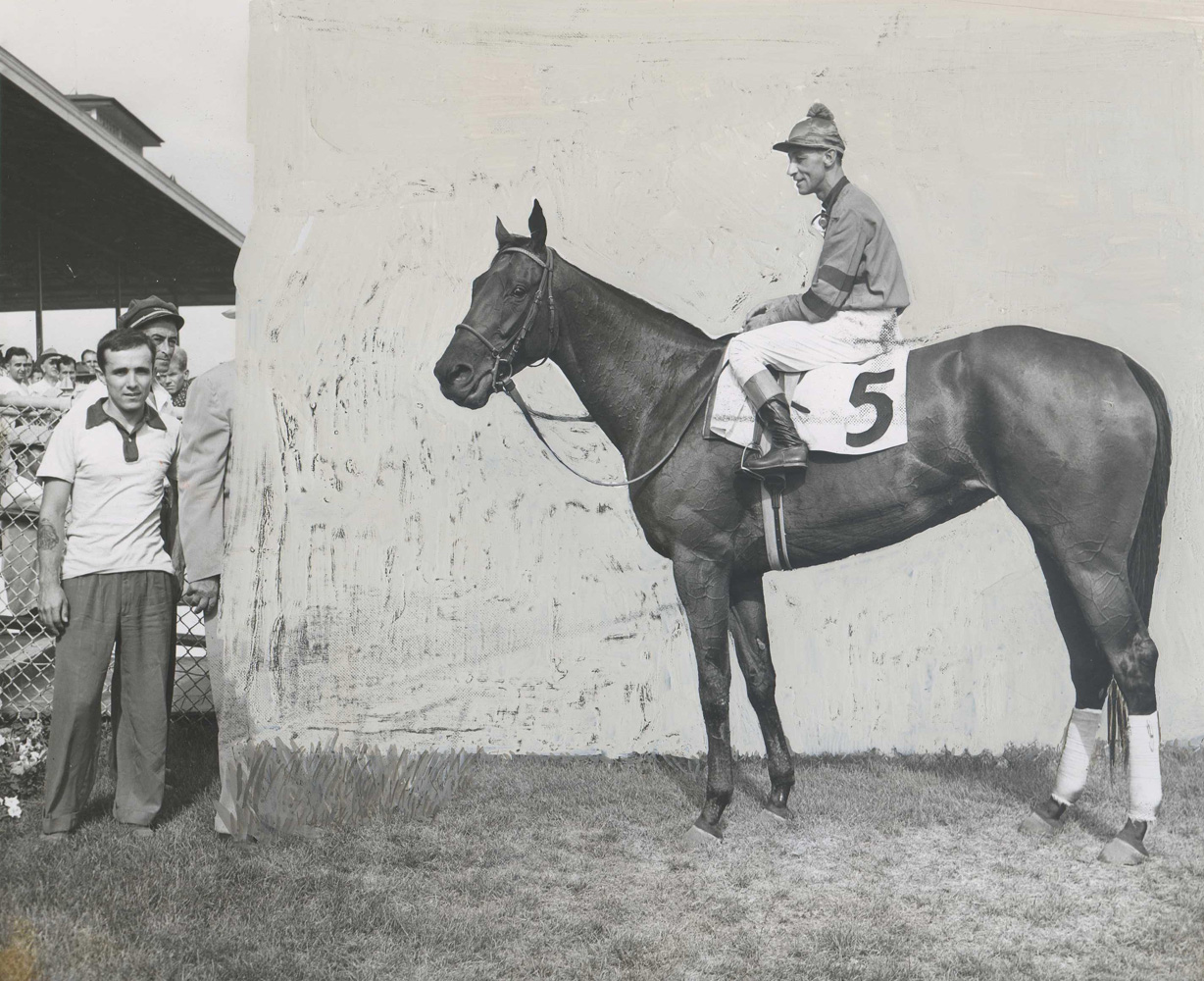 Hand-retouched winner's circle photo of Real Delight (Eddie Arcaro up) for the 1953 Arlington Matron Handicap at Arlington Park (Museum Collection)