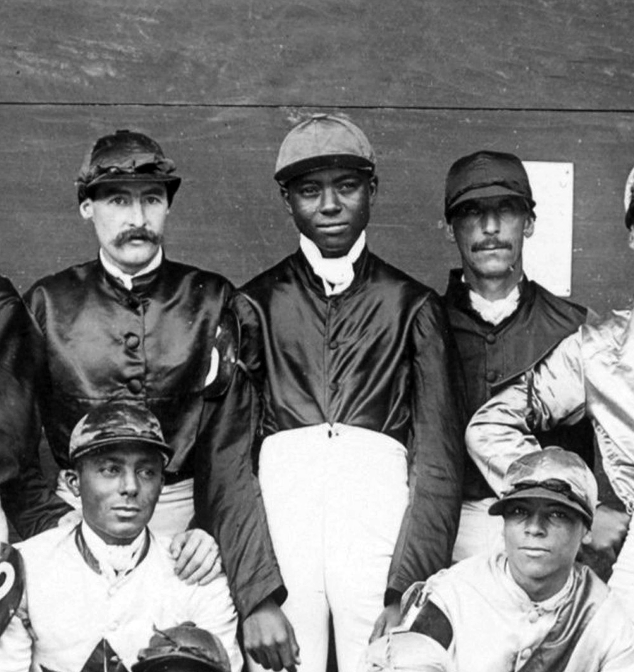 Shelby "Pike" Barnes (center) in a group portrait of a jockey colony (Keeneland Library Hemment Collection)