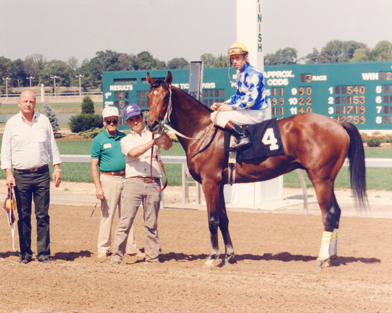 Don Brumfield and Alysheba in the winner's circle at Turfway Park (Lang Photos/Museum Collection)