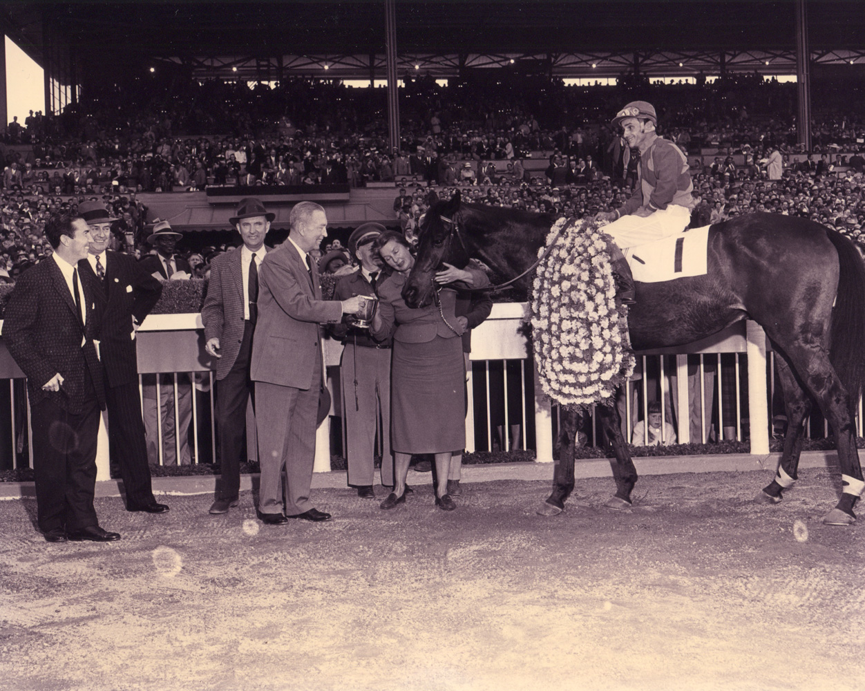 Ralph Neves and Cornhusker in the winner's circle for the 1957 Santa Anita Handicap (Santa Anita Photo/Museum Collection)