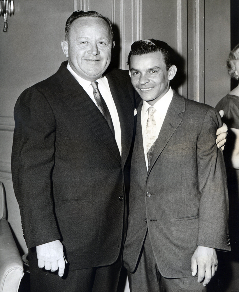 Trainer H. A. "Jimmy Jones" and Ismael "Milo" Valenzuela (Jerry Frutkoff/Pimlico Photo /Museum Collection)