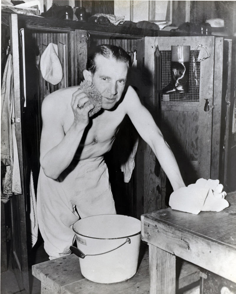 George Woolf in the locker room between races (Museum Collection)