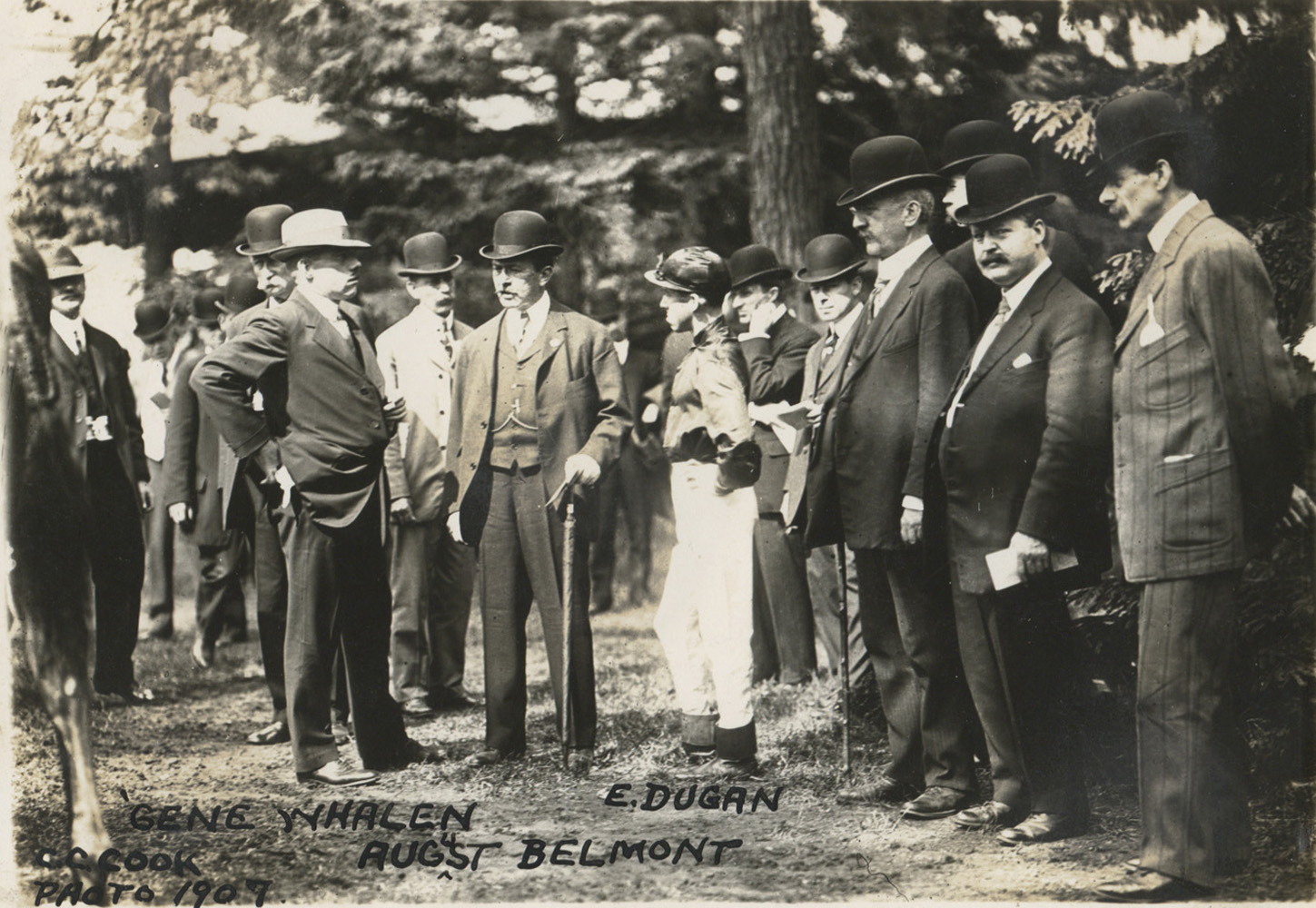 Gene Whalen, August Belmont, and jockey E. Dugan in the paddock, 1907 (C. C. Cook/Museum Collection)