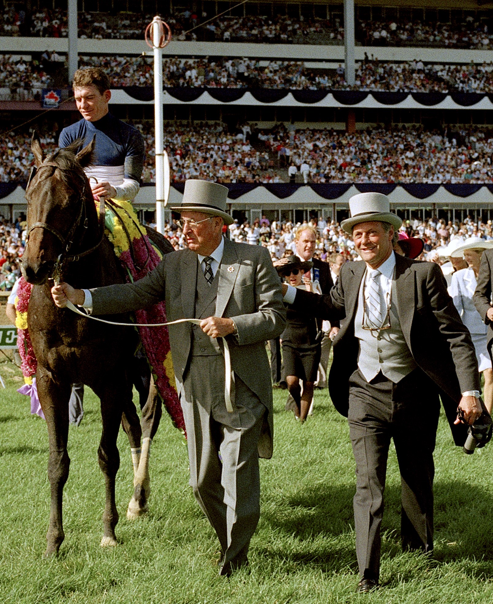 Roger Attfield and the winning connections of Alydeed celebrating their victory in the Queen's Plate. It was the 5th win in this prestigious event for Attfield (Woodbine Photo)