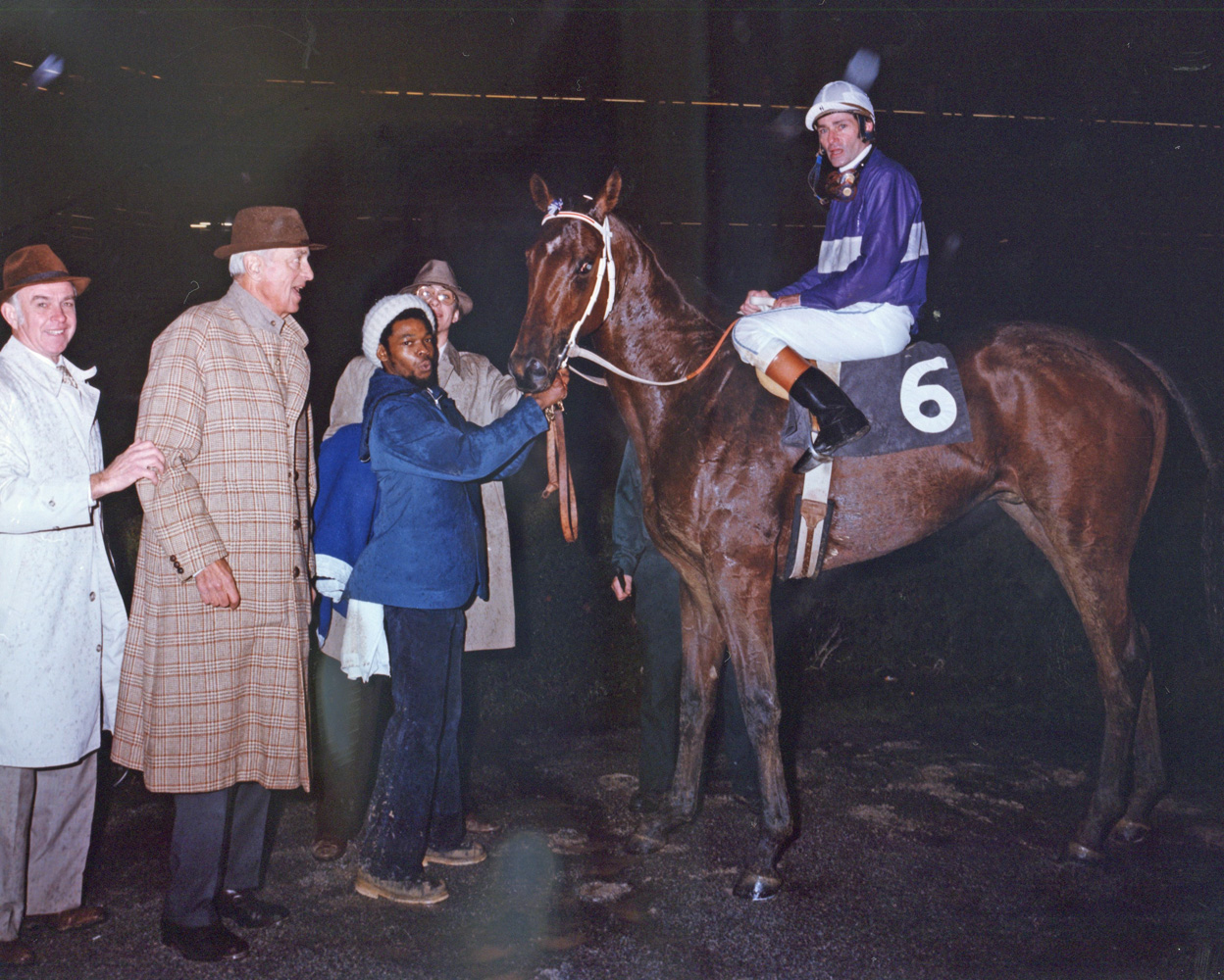 Trainer T. J. Kelly in the winner's circle with Plugged Nickle.